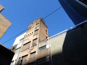 Looking up to the sky over old buildings, Burnett Lane, Brisbane